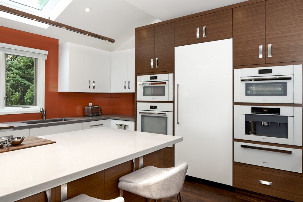 Brown cupboards with white appliances